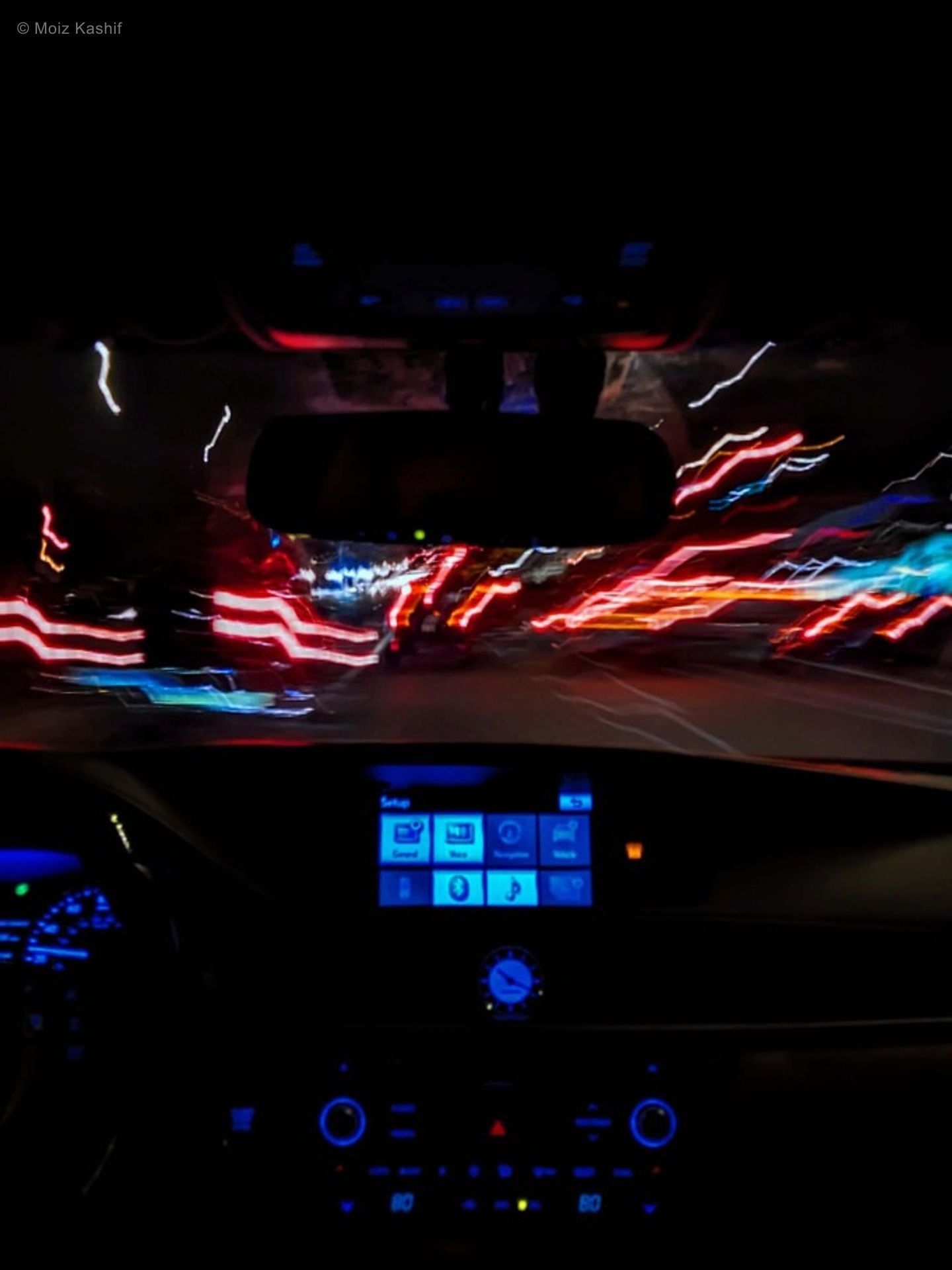 A blurred view from a moving vehicle in the fifth Mental Health frame.